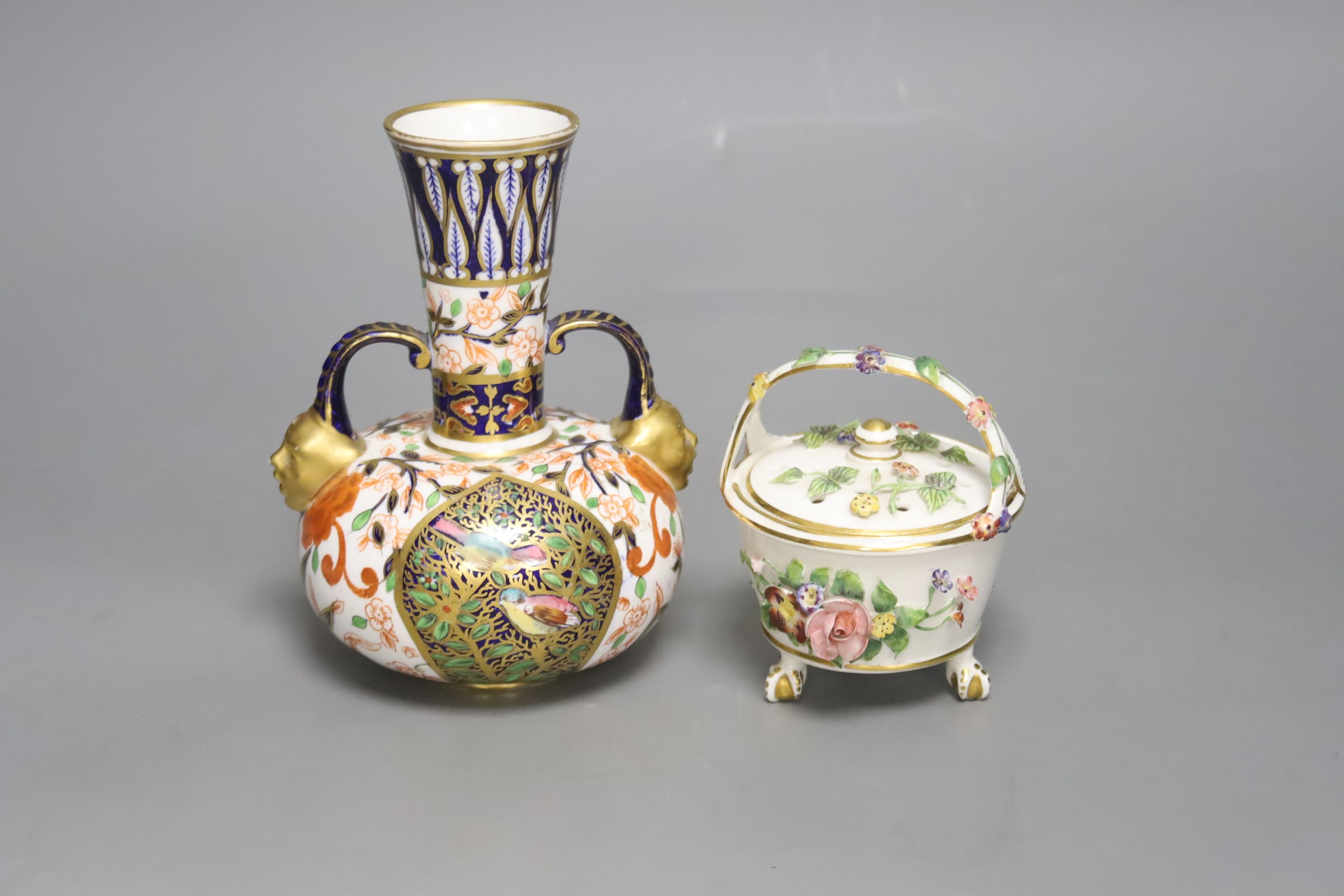 A Royal Crown Derby vase, with two mask head handles painted in Imari style, date code for 1882 and a Derby King Street pot pourri basket and cover c.1900, tallest 16cm